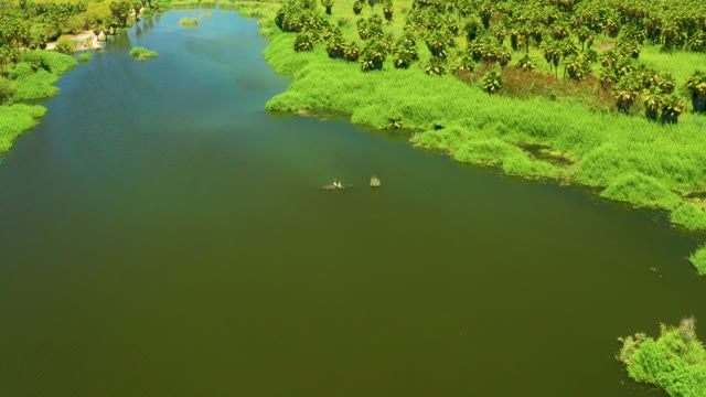 SAN JOSE DEL CABO ESTUARY BCS MEXICO-2021: River with Lush Green Banks and Moving Debris