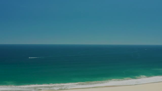 SAN JOSE DEL CABO ESTUARY BCS MEXICO-2021: Gentle Ocean Waves Rolling Onto Sandy Shore