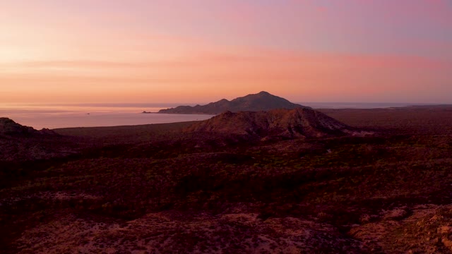 CABO PULMO BCS MEXICO-2021: Coastal Mountain Landscape at Sunset with Boat Passing