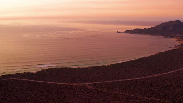 CABO PULMO BCS MEXICO-2021: Winding Coastal Road at Sunset Over Ocean