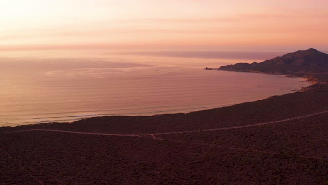 CABO PULMO BCS MEXICO-2021: Sunset over Coastal Road and Calm Ocean