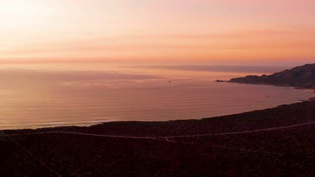 CABO PULMO BCS MEXICO-2021: Coastal Road at Sunset with Passing Car