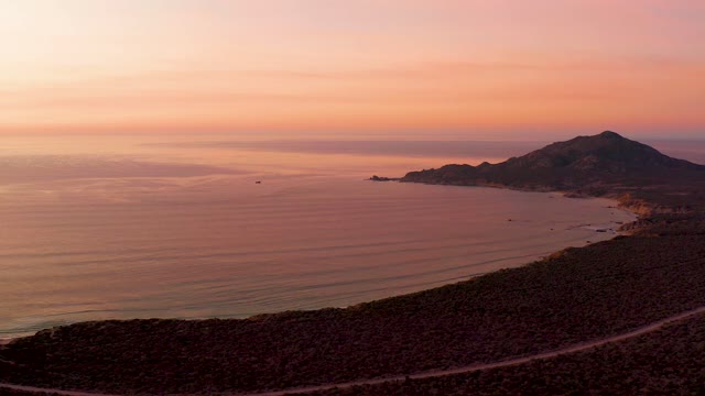 CABO PULMO BCS MEXICO-2021: Sunset Over Coastal Hill and Calm Ocean