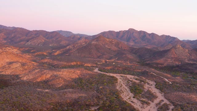 CABO PULMO BCS MEXICO-2021: Desert Landscape with Winding Dirt Road at Dusk