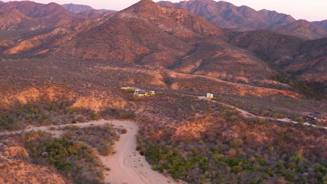 CABO PULMO BCS MEXICO-2021: Winding Dirt Road Through Arid Mountain Landscape