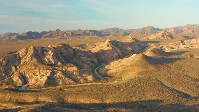 CABO PULMO BCS MEXICO-2021: Vehicle Traveling on Winding Desert Mountain Road