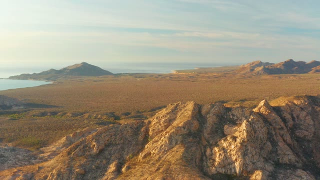 CABO PULMO BCS MEXICO-2021: Rocky Foreground Overlooking Coastal Plains and Distant Hills