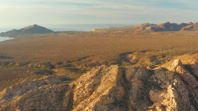 CABO PULMO BCS MEXICO-2021: Rocky Terrain Overlooking Vast Plain and Distant Mountains