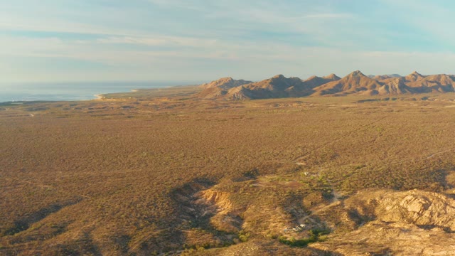 CABO PULMO BCS MEXICO-2021: Vehicle Traversing Arid Desert Landscape