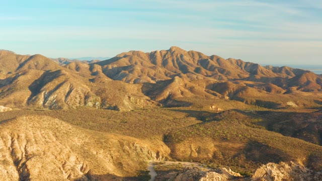 CABO PULMO BCS MEXICO-2021: Winding Mountain Road with Car Passing