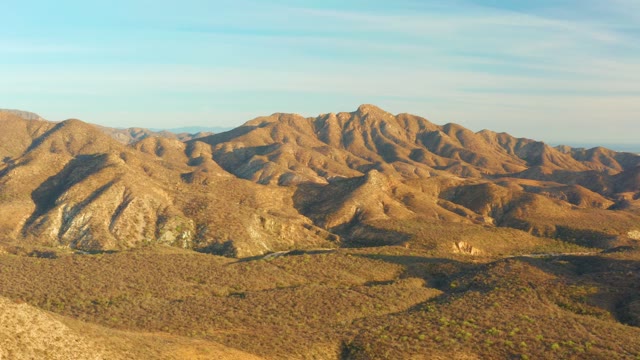 CABO PULMO BCS MEXICO-2021: Sunlight Casting Shifting Shadows on Mountain Ridges