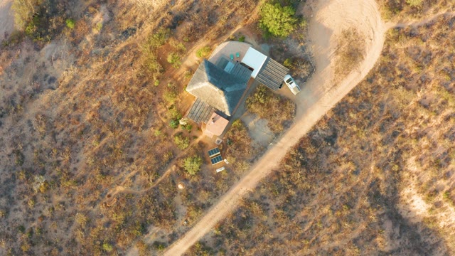CABO PULMO BCS MEXICO-2021: Person Walking Near House in Arid Field