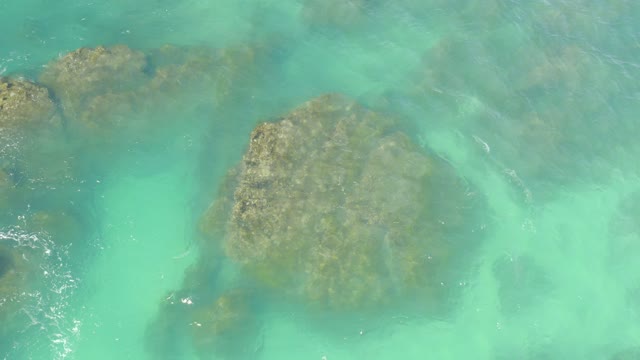 HILTON LOS CABOS MEXICO-2021: Gentle Ripples over Submerged Rocks in Clear Turquoise Water