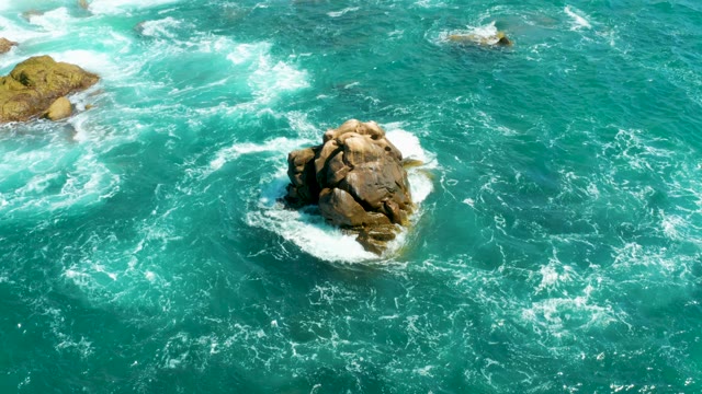 HILTON LOS CABOS MEXICO-2021: Waves Crashing Around Rocky Outcrops in Turquoise Water