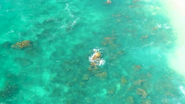 HILTON LOS CABOS MEXICO-2021: Gentle Waves Over Underwater Rocks in Turquoise Ocean