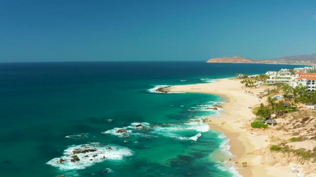 HILTON LOS CABOS MEXICO-2021: Waves Breaking on Rocky Shore with Sandy Beach