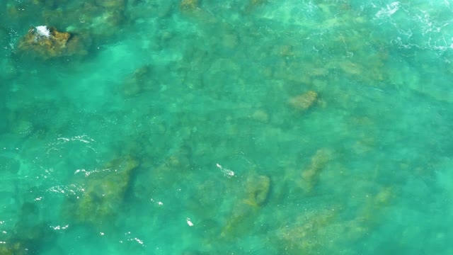 HILTON LOS CABOS MEXICO-2021: Clear Turquoise Water Over Submerged Rocks