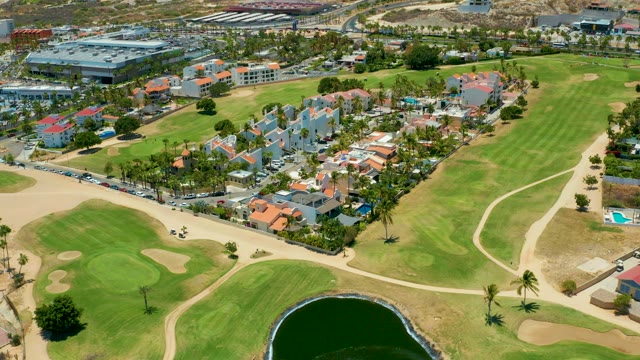 SAN JOSE DEL CABO BCS MEXICO-2021: Golf Course with Road and Passing Car