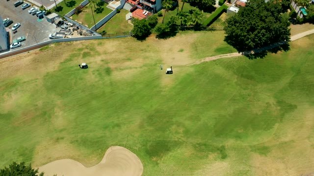 SAN JOSE DEL CABO BCS MEXICO-2021: Golf Carts and Parking Lot Activity on a Course