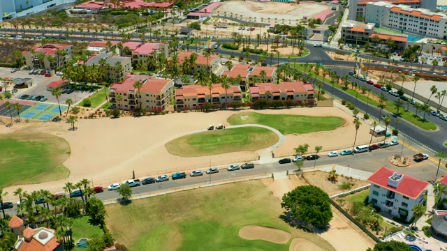 SAN JOSE DEL CABO BCS MEXICO-2021: Vehicles Moving on Residential Road Near Golf Course