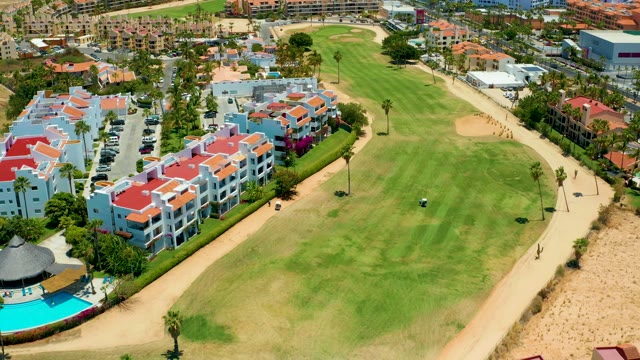 SAN JOSE DEL CABO BCS MEXICO-2021: Golf Course and Residential Buildings with Moving Figure