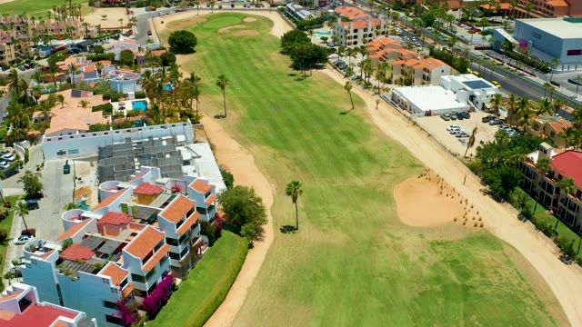 SAN JOSE DEL CABO BCS MEXICO-2021: Golf Course with Residential Buildings and Palm Trees