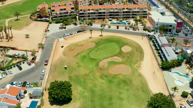 SAN JOSE DEL CABO BCS MEXICO-2021: Golf Cart and Vehicles Moving on Residential Course