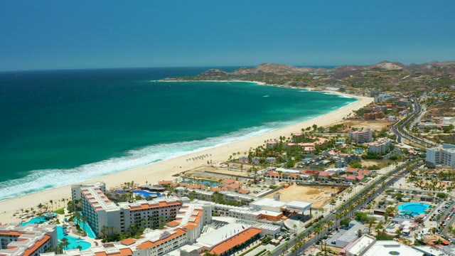 SAN JOSE DEL CABO BCS MEXICO-2021: Coastal Beach with Ocean Waves and Road Traffic