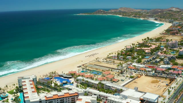 SAN JOSE DEL CABO BCS MEXICO-2021: Beach and Turquoise Ocean with Coastal Buildings