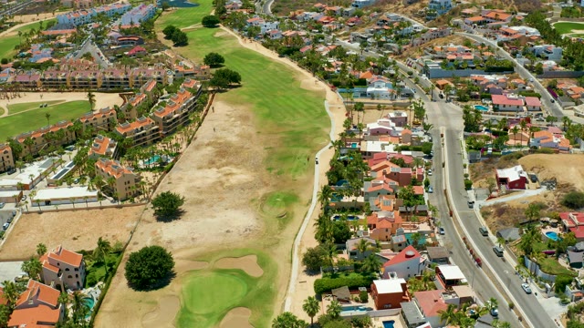 SAN JOSE DEL CABO BCS MEXICO-2021: Golf Course and Residential Neighborhood with Moving Traffic