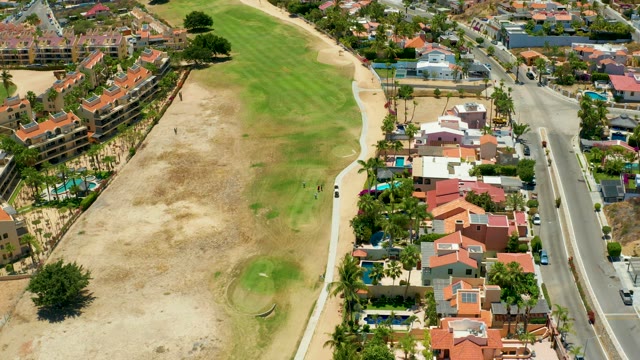 SAN JOSE DEL CABO BCS MEXICO-2021: People Walking on a Path Next to a Golf Course
