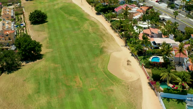 SAN JOSE DEL CABO BCS MEXICO-2021: Golf Course Green with Sand Bunker and Residential Area