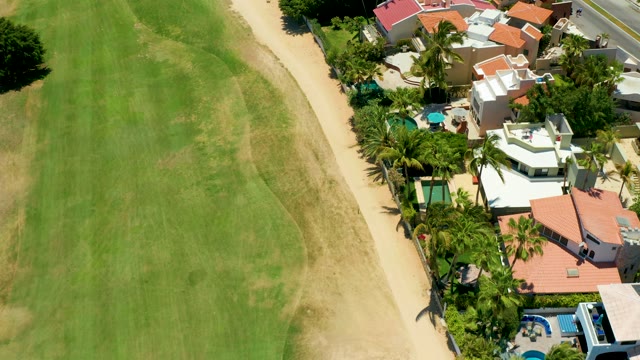 SAN JOSE DEL CABO BCS MEXICO-2021: Residential Homes Alongside a Manicured Green Field