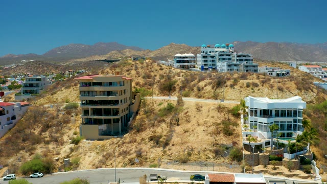 SAN JOSE DEL CABO BCS MEXICO-2021: Residential Hillside with Arid Vegetation and Road