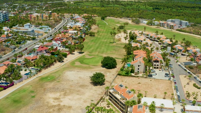 SAN JOSE DEL CABO BCS MEXICO-2021: Moving Cars on Highway Near Golf Course