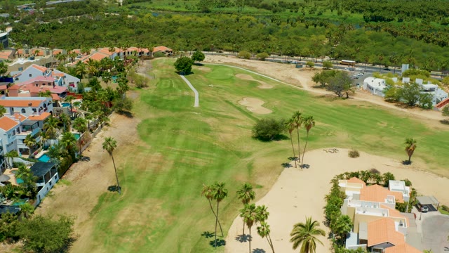 SAN JOSE DEL CABO BCS MEXICO-2021: Golf Course with Residential Buildings and Palm Trees