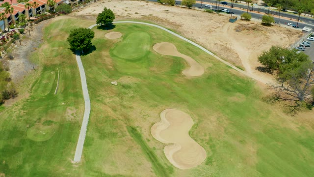 SAN JOSE DEL CABO BCS MEXICO-2021: Golf Course with Moving Traffic on Nearby Road