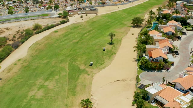 SAN JOSE DEL CABO BCS MEXICO-2021: Golf Cart Moving on a Golf Course