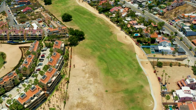 SAN JOSE DEL CABO BCS MEXICO-2021: Coastal Residential Area with Moving Traffic and Sandy Beach