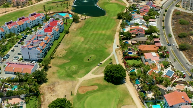 SAN JOSE DEL CABO BCS MEXICO-2021: Golf Course with Residential Buildings and Road