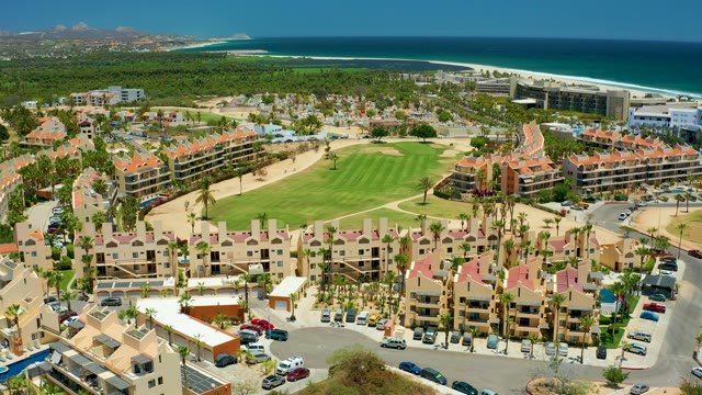 SAN JOSE DEL CABO BCS MEXICO-2021: Coastal Resort with Moving Parking Lot Vehicles and Golf Course