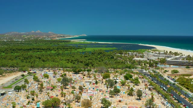 SAN JOSE DEL CABO BCS MEXICO-2021: Coastal Road Traffic and Beachside Parking Area