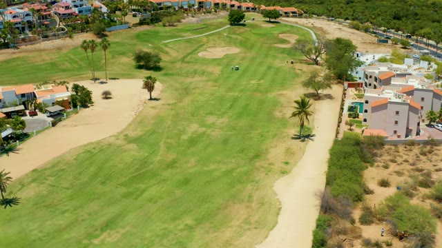 SAN JOSE DEL CABO BCS MEXICO-2021: Golf Course with Palm Trees and Residential Buildings