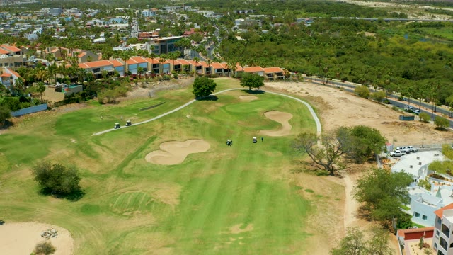 SAN JOSE DEL CABO BCS MEXICO-2021: Golf Carts Moving on a Golf Course