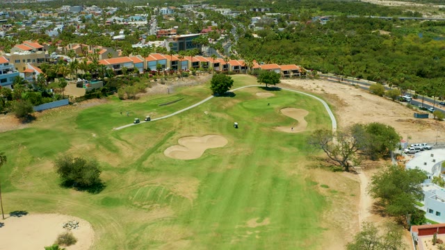 SAN JOSE DEL CABO BCS MEXICO-2021: Golfer Moving on Golf Course Green