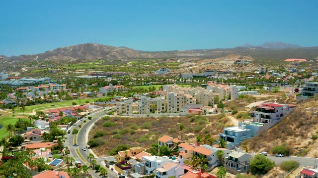 SAN JOSE DEL CABO BCS MEXICO-2021: Car Moving on Winding Residential Road