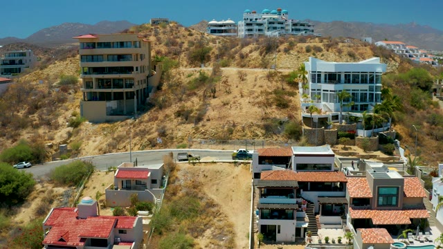 SAN JOSE DEL CABO BCS MEXICO-2021: Hillside Residential Area with Moving Cars