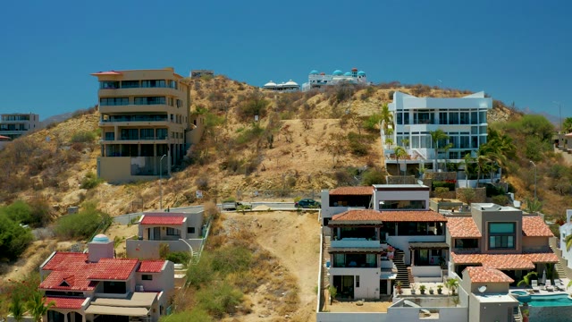 SAN JOSE DEL CABO BCS MEXICO-2021: Residential Hillside with Car on Winding Road