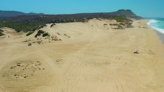 LA LAGUNA BEACH LOS CABOS MEXICO-2021: 4x4 Vehicle Driving on Coastal Sand Dunes