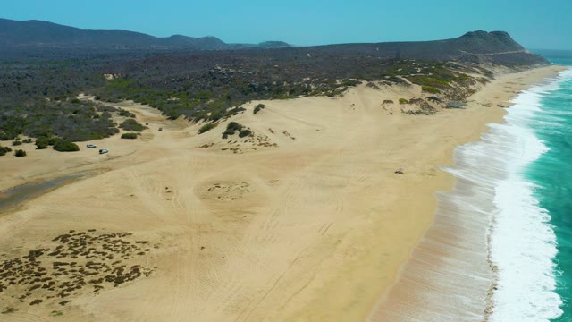 LA LAGUNA BEACH LOS CABOS MEXICO-2021: Vehicles Driving on Coastal Sand Dunes